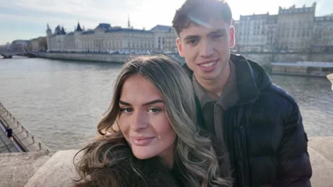 Handheld POV Couple in Paris Taking Candid Selfies on Bridge Over Seine River Stock Footage 328105192
