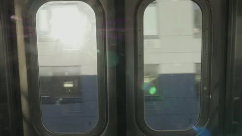 Handheld POV shot looking out the window of a New York City subway car Stock Footage 262672691