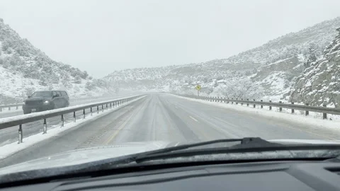 Handheld POV through Truck Windshield Driving in Snow Storm in Mountains Stock Footage 256509727