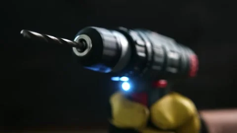 Handheld Power Drill With Drill Bit in Focus During Home Repair Work Stock Footage 341575708