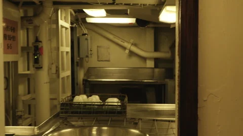 Handheld Pullback From Commercial Kitchen Through Service Hutch on Navy Ship Stock Footage 322071296