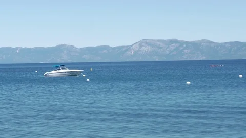 Handheld quick dolly around boat floating in lake Stock Footage 79475488