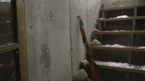 Handheld Reaching for Assault Rifle Video stock 171052633