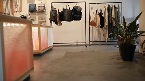 Handheld rear view shot of a man walking out of the store Video stock 114886095