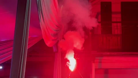 Handheld red flare burning in night atmosphere 動画素材 337569245