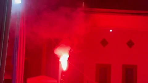 Handheld red flare burning in night atmosphere 스톡 동영상 340479817