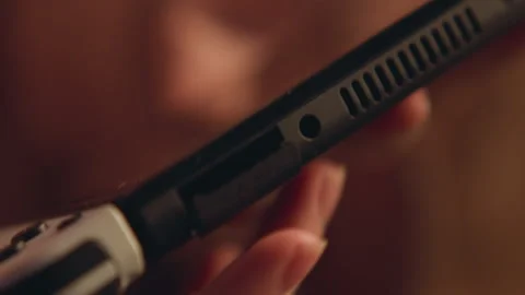 Handheld shaving scene showing electric shaver edge touching facial stubble with Stock Footage 343542961