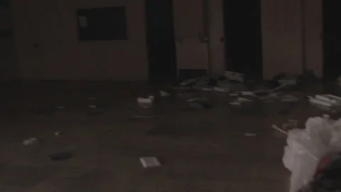 Handheld shot of abandoned classroom filled with trash Stock Footage 252292453
