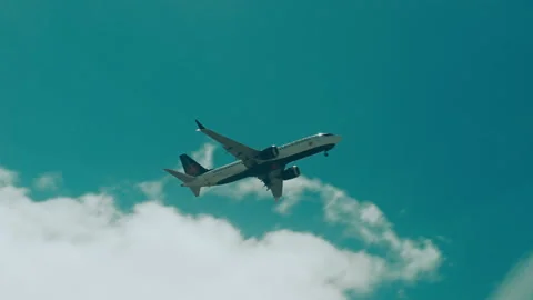 Handheld shot of airplane flying through window of train Stock Footage 219829833