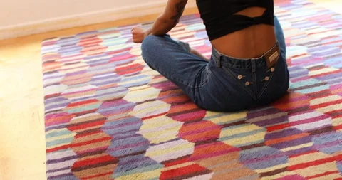 Handheld shot and rear view of woman sitting and swaying to music Stock Footage 119832233