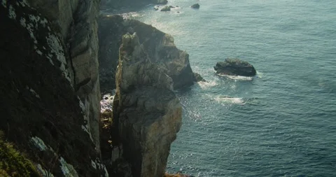Handheld Shot of Atlantic Waves Crashing on Cabo Peñas Cliffs, Asturias Video stock 341432059