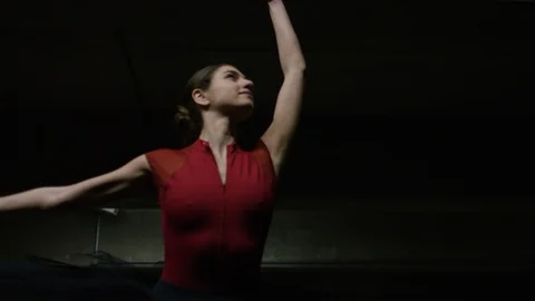 Handheld shot of ballet dancer on pointe in a car park, in slow motion Stock Footage 85594418