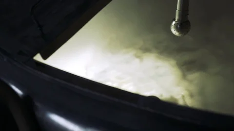 Handheld shot of beer being prepared in container at brewery Stock Footage