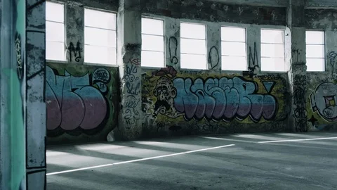 Handheld shot of big hall inside an abandoned warehouse Stock Footage 112896766