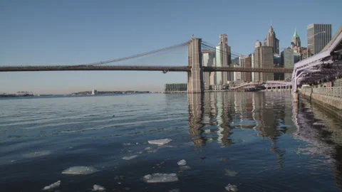Handheld shot of the Brooklyn Bridge and The East River Stock Footage 328905189