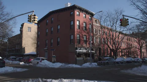 Handheld shot of a Brooklyn corner store Stock Footage 328337566
