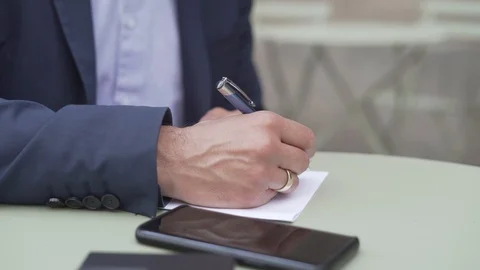 Handheld shot of businessman using mobile phone in cafe Stock Footage 120154825