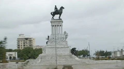 Handheld shot from car of monument to Maximo Gomez on cloudy day, Cuba Stock Footage 141667377