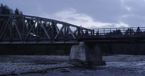 Handheld shot of car passing old bridge Stock Footage 147634237
