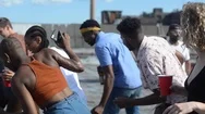 Handheld Shot Of Cheerful Friends Dancing On Building Terrace Stock Footage