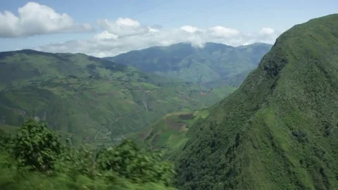 A handheld shot close to the edge of a dirty road in Ecuador Stock Footage 79062475