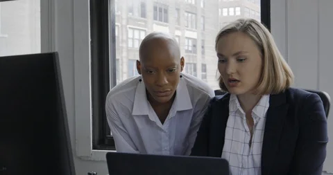 Handheld shot of co-workers discussing business findings Stock Footage 114844209