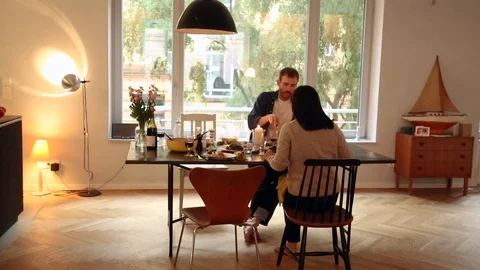 Handheld shot of a couple having dinner together 스톡 동영상 114846695