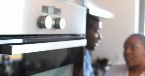 Handheld shot of couple talking with each other in kitchen Stock Footage 119752056