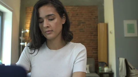Handheld shot of a creative freelancer drinking coffee while working in office Stock Footage 114854929