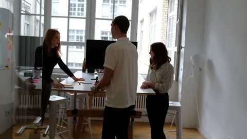 Handheld shot of creative professionals leaving office room after meeting Video stock 120432881