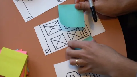 Handheld shot of cropped hand making plan for mobile app Stock Footage 120153278