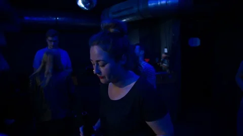 Handheld shot of crowd dancing on dance floor at nightclub Stock Footage 115090323