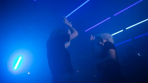 Handheld shot of dancing ladies on dance floor Video stock 115090262