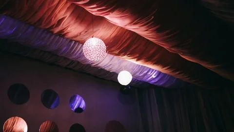 Handheld shot of decorations on ceiling during party Stock Footage 122516912