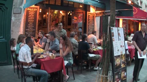 Handheld shot of diners in a Paris cafe, France. Stock Footage 8680860