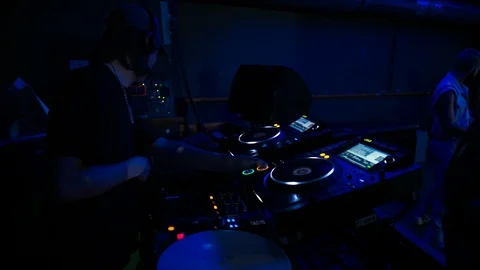 Handheld shot of DJ hands accessing DJ controller Stock Footage 115089803