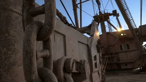 Handheld shot of dragline super heavy excavator with headlights on standing on Stock Footage 75539806