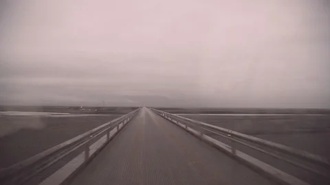 Handheld shot of Driving across the single lane bridge Stock Footage 118654703