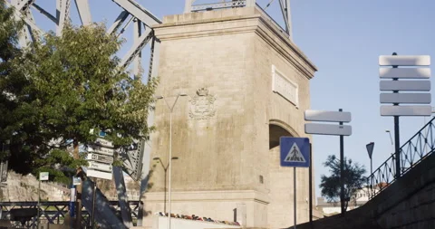 Handheld shot of driving through roads in Porto city underneath wired sign Stock Footage 155251519
