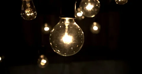 Handheld shot of edison bulbs Stock Footage 98366097