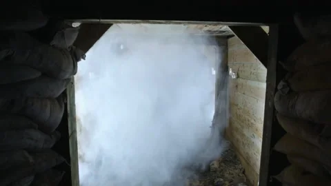 Handheld shot of an explosion in an underground bunker - Reenactment Stock Footage 202905611