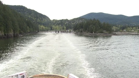 Handheld shot from ferry looking out at islands and harbour Stock Footage 75249546