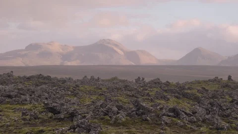Handheld shot of flat valley in front of mountains Stock Footage 118654795