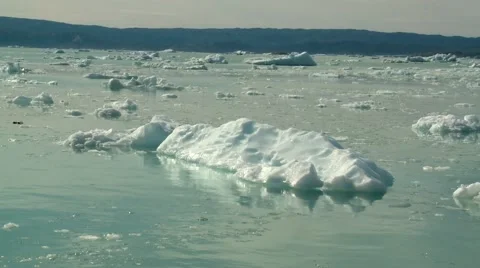 Handheld shot of floating ice in front of calving glacier in Greenland Stock Footage 60004181
