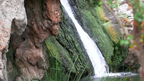 Handheld Shot of a Flowing Waterfall from the Side Stock Footage 219345356