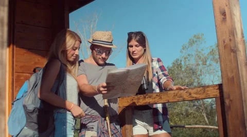 Handheld shot of friends checking map outdoors Stock-Footage 55035826