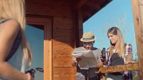 Handheld shot of friends checking map outdoors Stock Footage 55036500