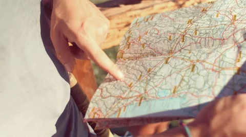 Handheld shot of friends checking map outdoors Stock Footage 55037707