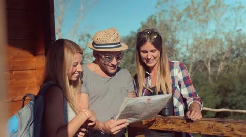 Handheld shot of friends checking map outdoors Stock-Footage 55038592