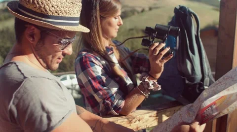 Handheld shot of friends checking map outdoors Video stock 55040336
